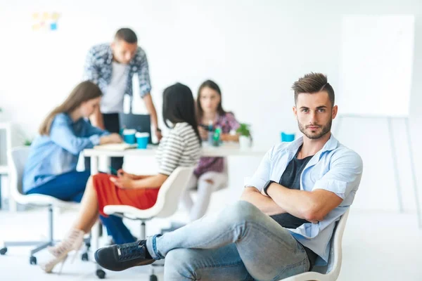 Businessman sitting on chair — Stock Photo, Image