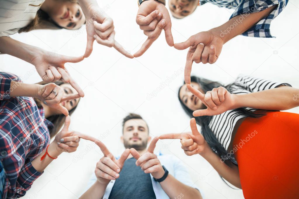 people making star shape with fingers