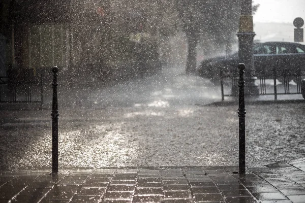 Pavement and car in rainy day — Stock Photo, Image