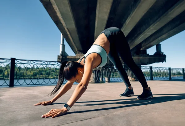 Young Sporty Woman Doing Yoga Asana Downward Facing Dog Industrial — 스톡 사진