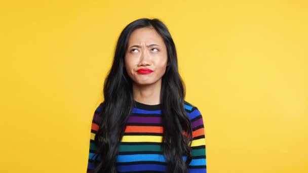 Boring asian woman showing bla-bla-bla gesture with hands looking to camera — Stock Video