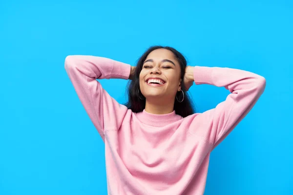 Happy laughing black woman on blue background — Stock Photo, Image