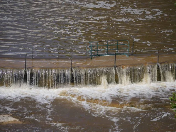 Flooded waters overflowing