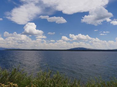 Yellowstone Lake with gorgeous clouds in the skies at Yellowstone National Park, Wyoming, USA. clipart