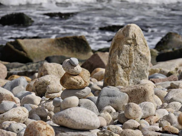 Artistic pile of stones and rocks at the beach