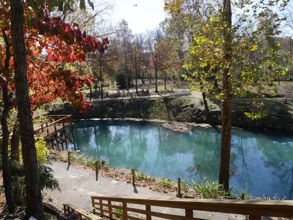 Blue spring waters and colorful trees in autumn