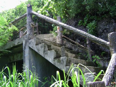 Concrete stairs installed going to a beach in a tropical island.