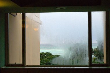 Rainy day seen through wide glass windows