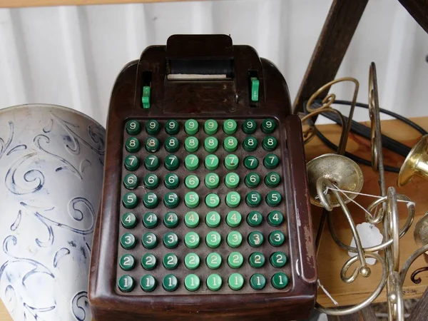 Vintage adding machine and a bunch of junk sold at a flea market