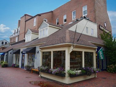 Newport, Rhode Island-September 2017: Attractive souvenir shop store fronts with brick-paved sidewalks in Newport.