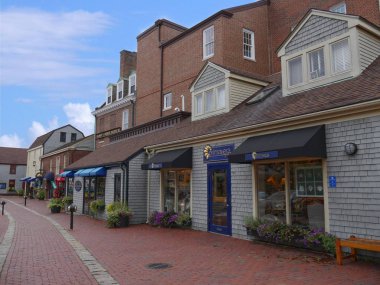 Newport, Rhode Island-September 2017: Colorful stores and souvenir shops along brick-paved sidewalks in Newport.