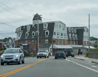 Jamestown, Rhode Island September 2017: Vehicles travelling along the paved roads along buildings in Jamestown.