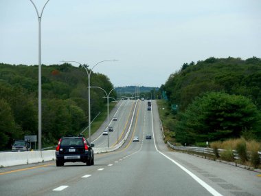 Narragansett, Rhode Island-September 2017: Street photography with vehicles traveling along the road.