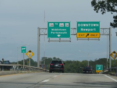 Newport, Rhode Island-September 2017: Directional signs on the road with arrows pointing to the directions of Middletown, Portsmouth, and Downtown Newport.