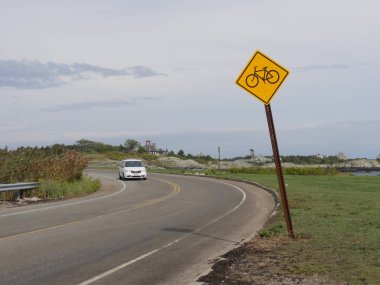 Newport, Rhode Island-September 2017: Roadside sign for bicyle riders along the ocean drive in Newport. 