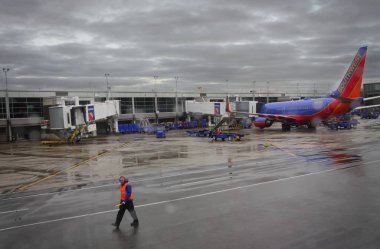 Baltimore, Maryland- September 2017: A ground crew walks in the tarmac of the Baltimore Washington International Thurgood Marshall Airport, Maryland.