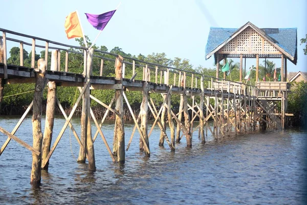 Wooden walkway on long poles at Britania Islands, Surigao del Sur, Philippines.