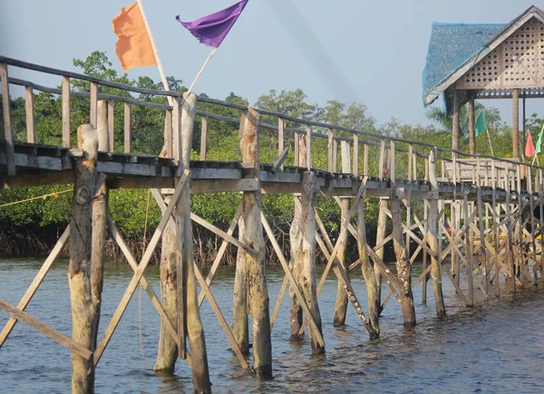 Close up of a wooden walkway on long poles at Britania Islands, Surigao del Sur, Philippines.