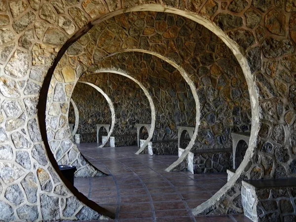 Concrete arches with tables and benches at the Tops overlooking Cebu City.