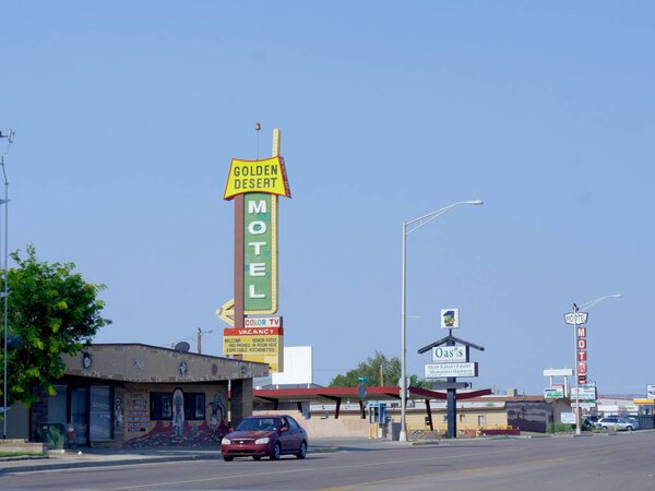 Gallup, New Mexico- August 2018: Street view with roadside signs infront of of motels in Gallup.