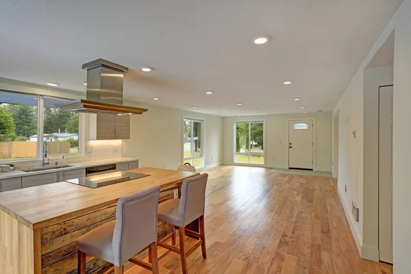 Open floor plan interior features a newly remodeled kitchen