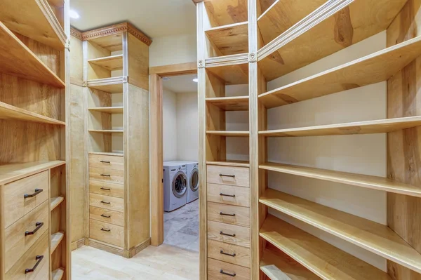 Large walk-in closet lined with built-in drawers — Stock Photo, Image