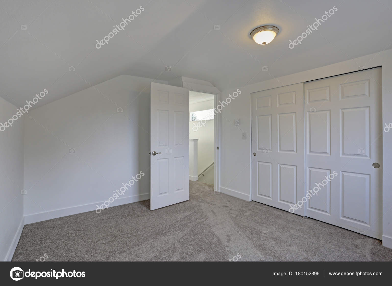Empty Bedroom Interior With Vaulted Ceiling On The Upper