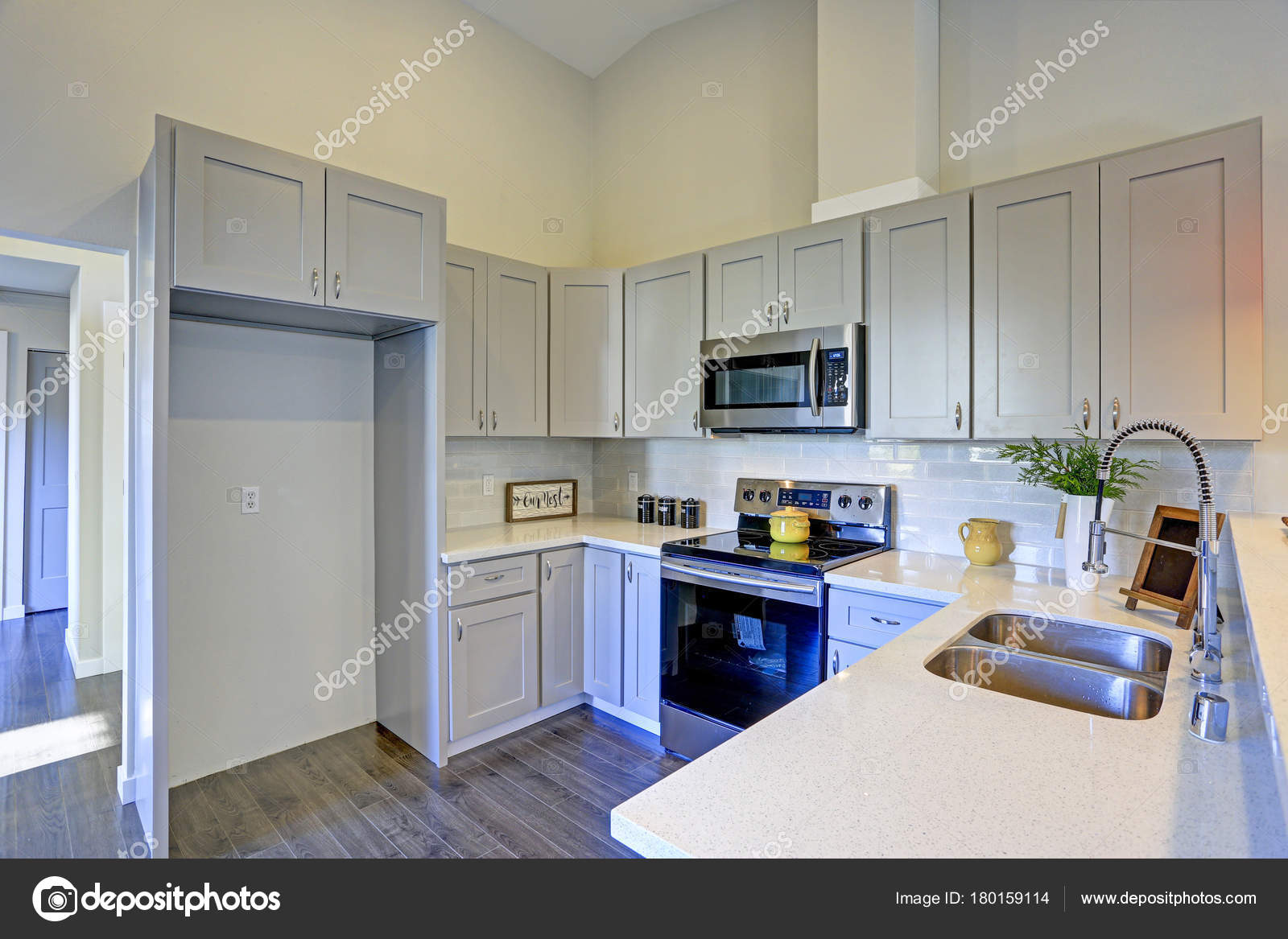 Light Grey Kitchen Room Interior With Vaulted Ceiling Stock