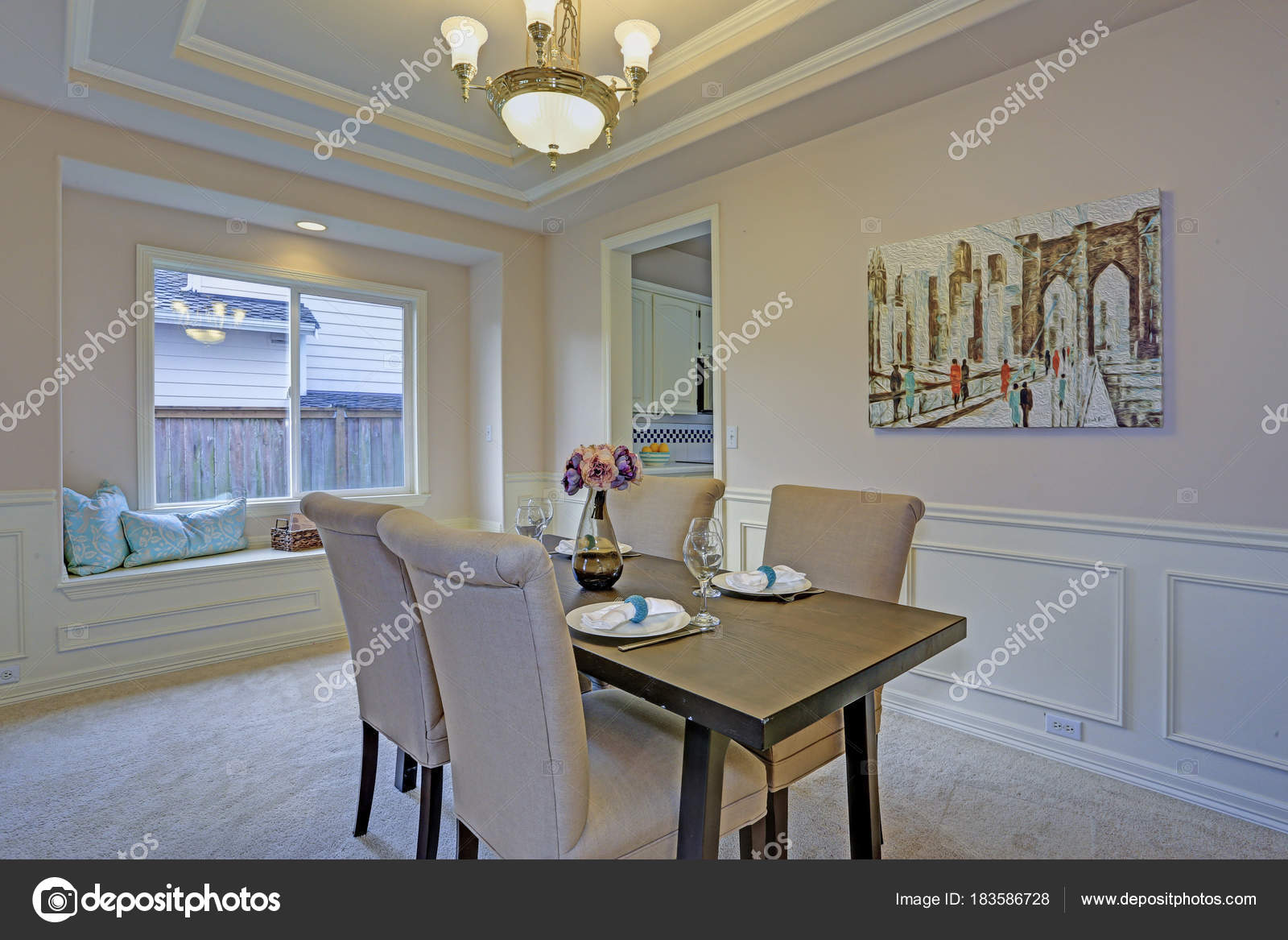 Chic Dining Room Accented With Wall Panel Mouldings And Tray