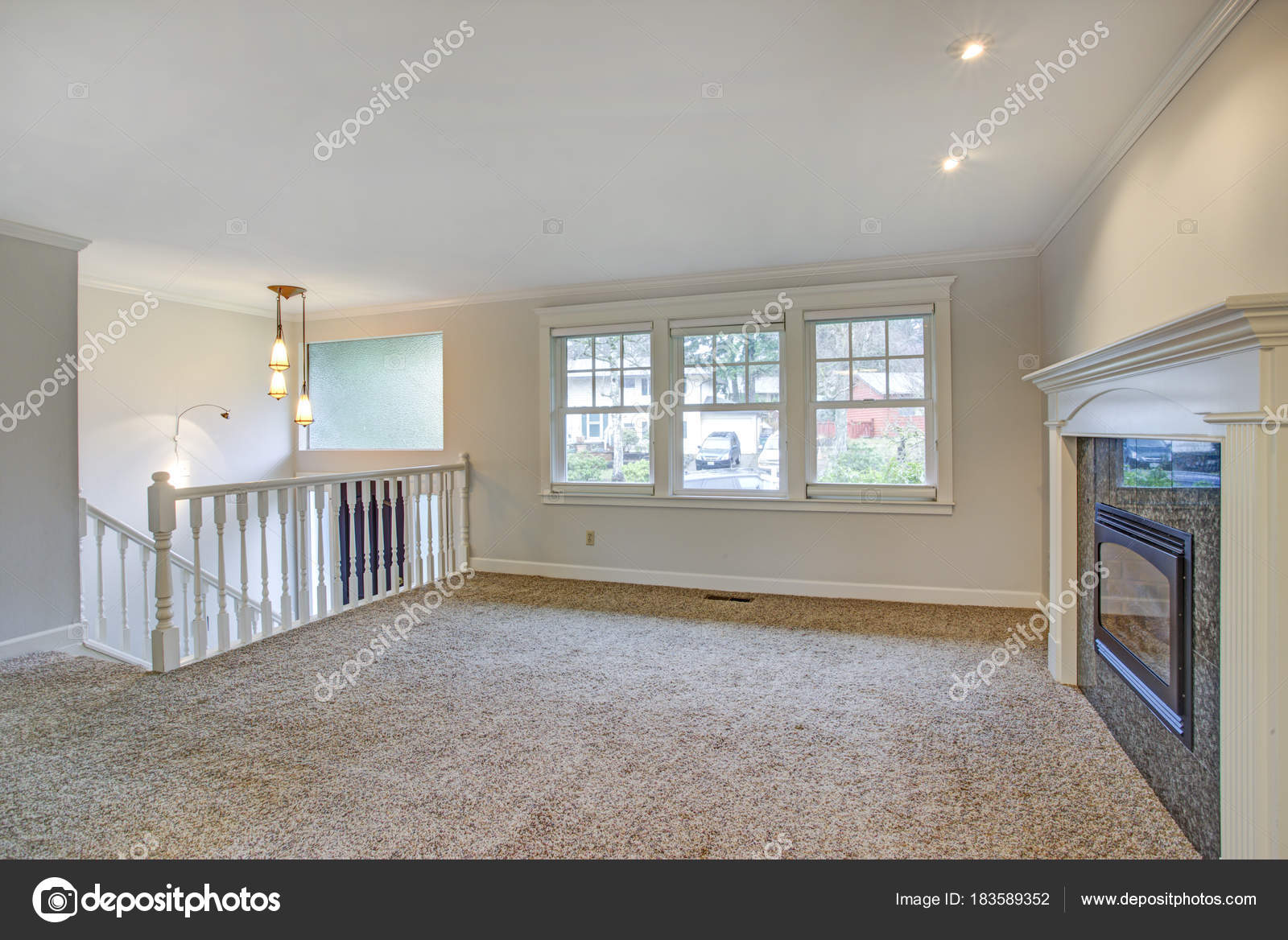 Light Open Living Area With Traditional Fireplace Stock Photo