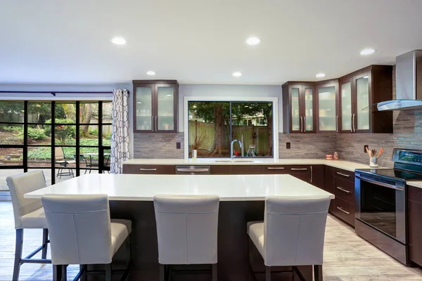 Updated contemporary kitchen room interior in white and brown tones. — Stock Photo, Image