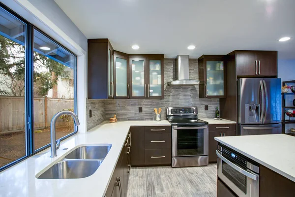 Updated contemporary kitchen room interior in white and dark tones. — Stock Photo, Image