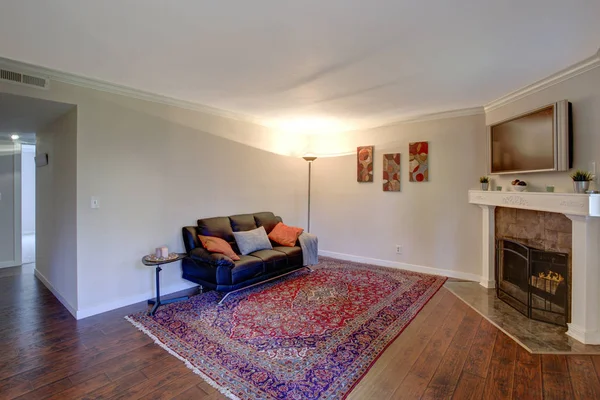 Interior of a living room with corner fireplace.