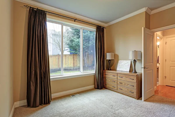 Small Empty Room with brown silk curtains