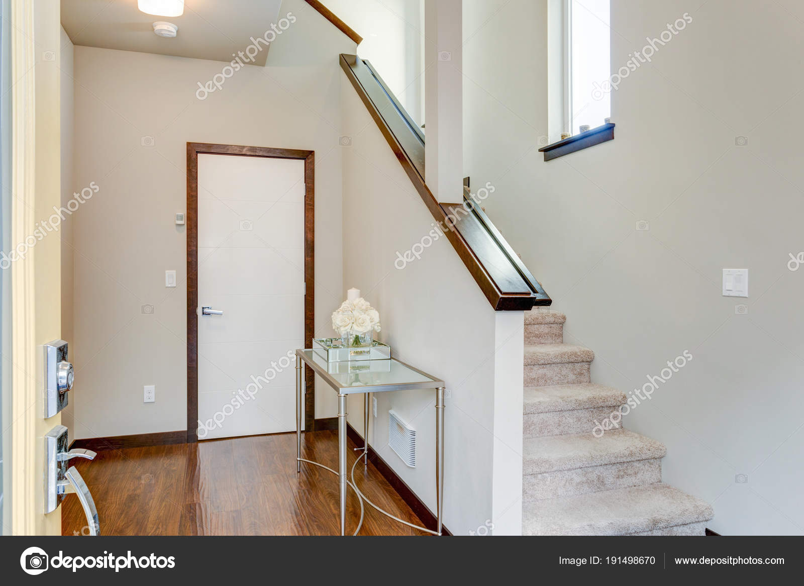 Entrance Foyer With White Walls And Staircase Stock Photo