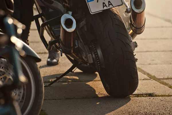 Motorcycle wheel closeup. Motorcycle metal parts. Biker meeting in the city.