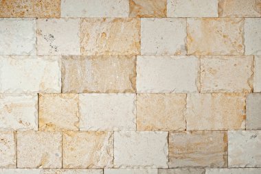 Çok renkli dekoratif bloklardan yapılmış duvar dokusu. İç dekorasyon için tuğla düzeyi.