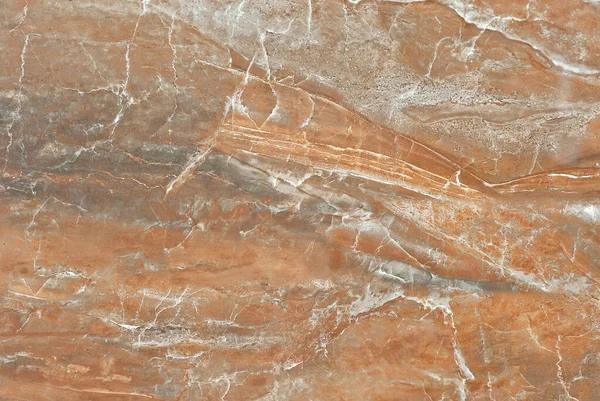 Texture of yellow and orange marble. Stone tile with natural pattern. Marble pavement closeup.