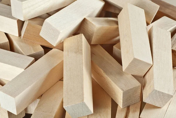 stock image Texture of rectangular wooden bars. Kids playing with cubes. Wooden constructor dumped.