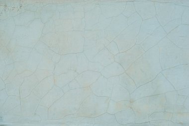 Çatlakları ve çizikleri olan mavi beton duvar. Çizik, eski ve yıpranmış duvar dokusu.