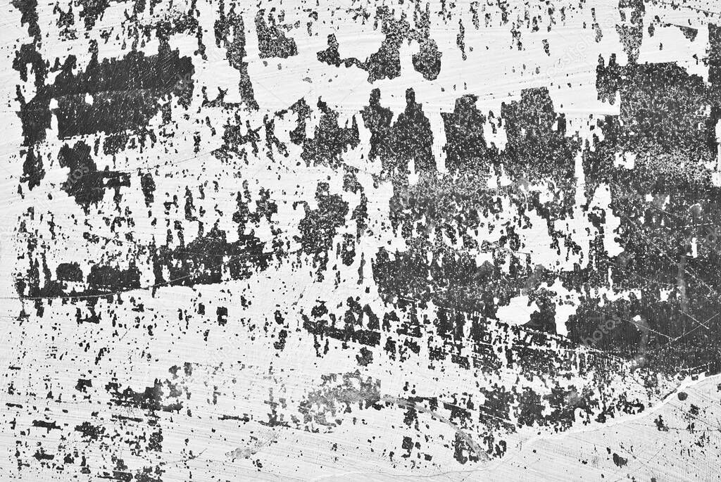 Texture of an old concrete wall with cracks. Black and white wall with dirt and scratches.