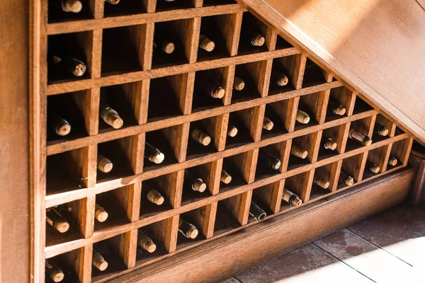 Bottles of great wine in a winery cellar — Stock Photo, Image