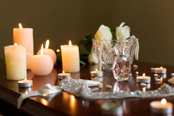 Bridal morning: perfumes and burning candles — Stock Photo, Image