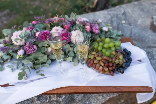 Romantic Dinner Outdoors Glasses Champagne Grapes Lot Flowers Wooden Board — Stock Photo, Image