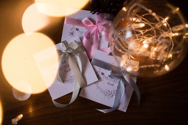 Three Gift Photoshoot Cards Colorful Ribbons Lights Garland Vase Royalty Free Stock Images