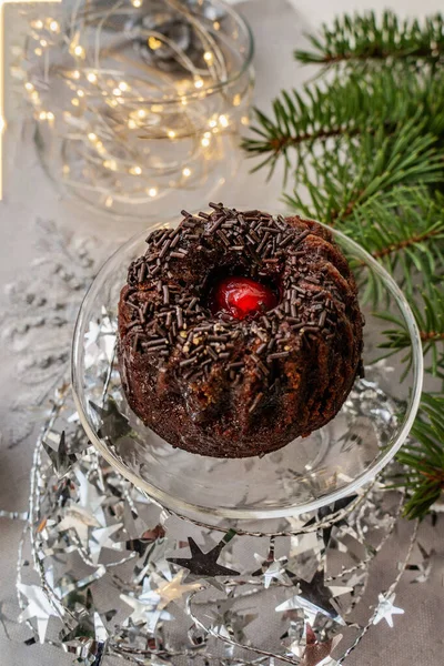 Chocolate mint cupcakes with sugar chocolate chips on the Christmas table