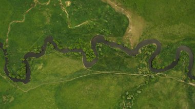 A beautiful narrow and winding river view from above. clipart