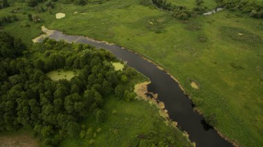 Landscape of a meandering river aerial survey clipart
