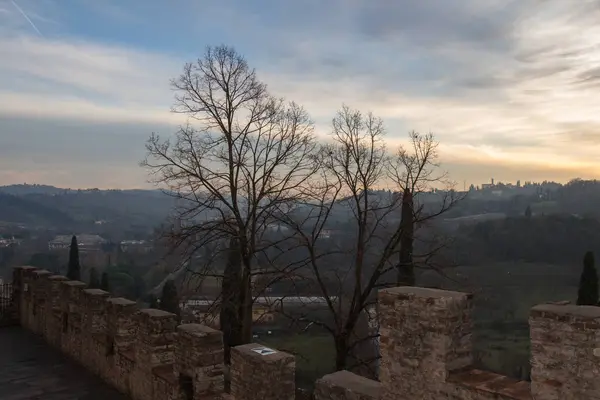 Ancient wall of Certosa di firenze and Tuscan landscape on background. Italy. — Stock Photo, Image