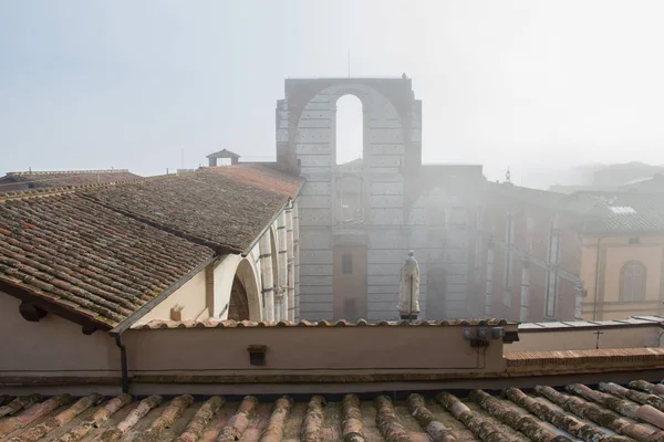 Incomplete facade of the planned Duomo nuovo or Facciatone in fog. Siena. Tuscany Italy. — Stock Photo, Image